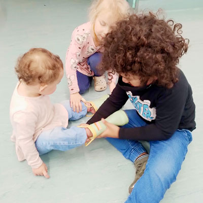 A teacher supporting outdoor discovery
